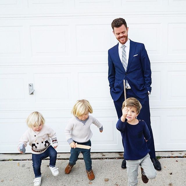 Brandon Michael Osmond in a blue formal attire and his children in t-shirts and pants.